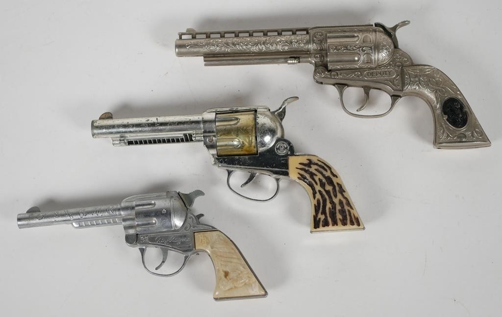 THREE VINTAGE TOY REVOLVER CAP