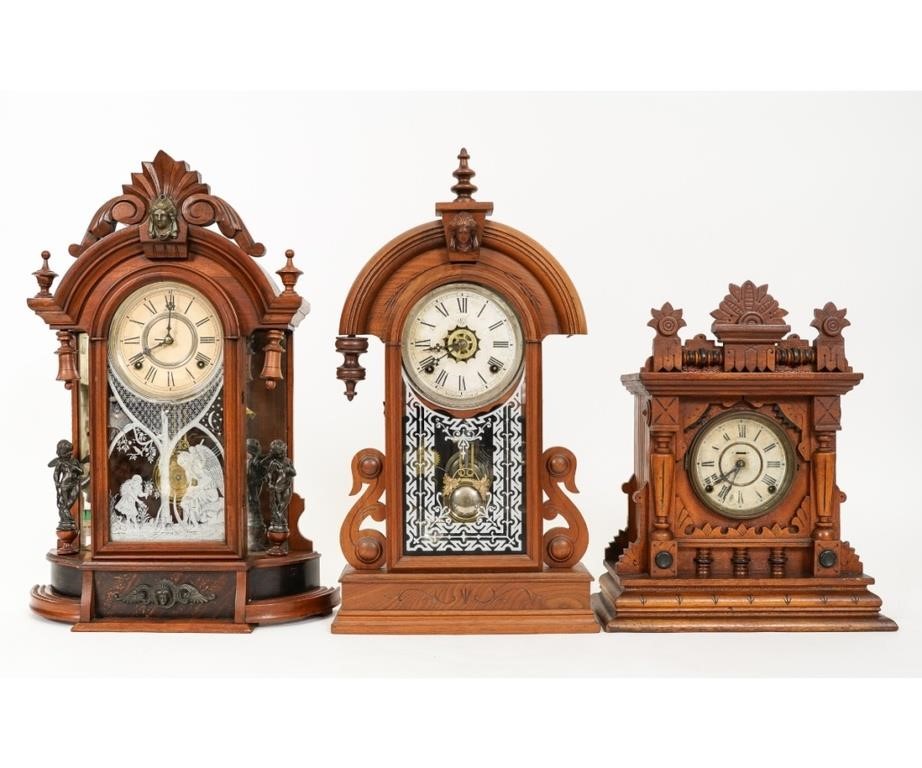 Three walnut mantel clocks, two