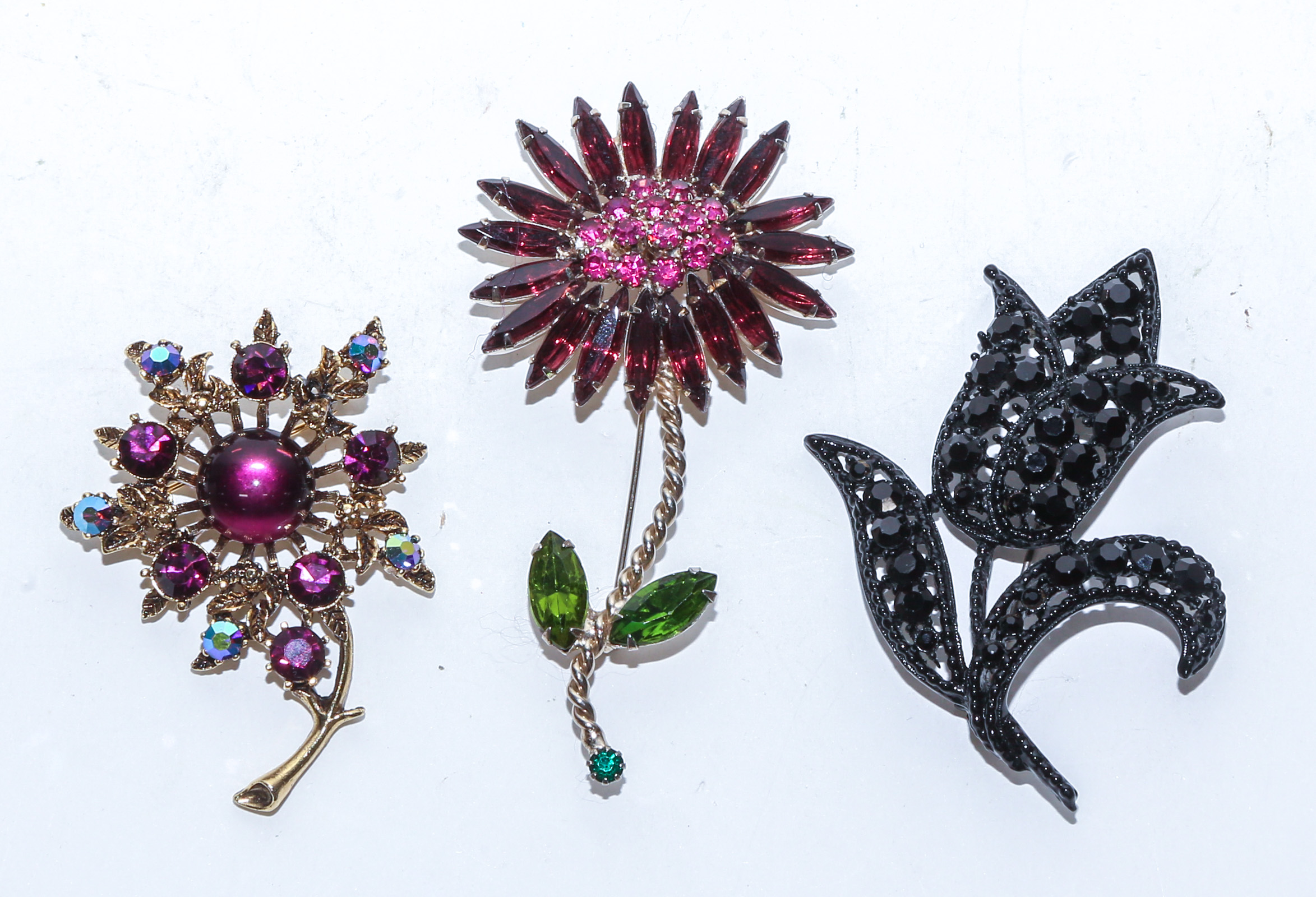 THREE WEISS BROOCHES Comprising a