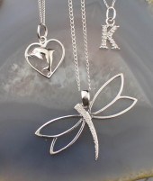 THREE WHITE GOLD PENDANT NECKL