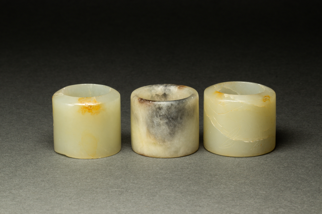 THREE WHITE JADE ARCHER'S RINGS