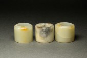 THREE WHITE JADE ARCHER'S RING