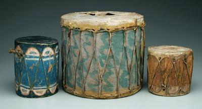 Three wood and hide drums: one with