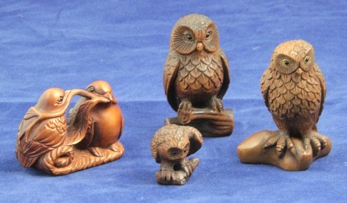 Three wooden netsuke signed each in