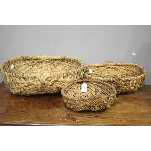 Three woven baskets, AF to handles,