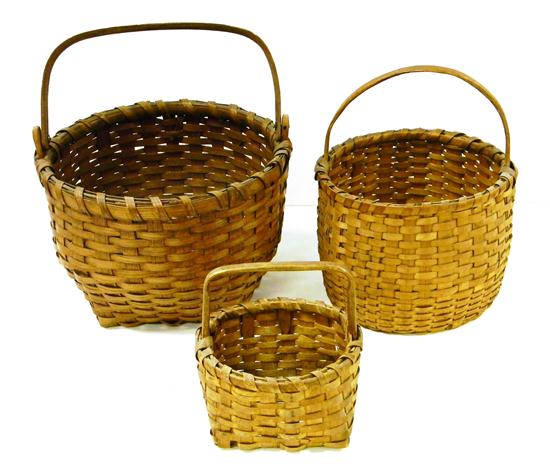 Three woven baskets: one with