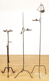 THREE WROUGHT IRON STANDING LI