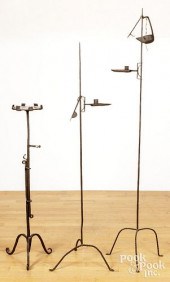 THREE WROUGHT IRON STANDING LI