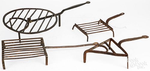 THREE WROUGHT IRON TRIVETS AND A