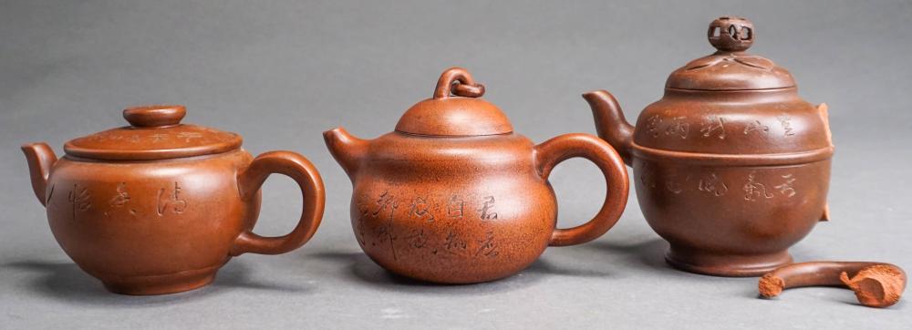THREE YIXING WARE TYPE TEAPOTS (ONE