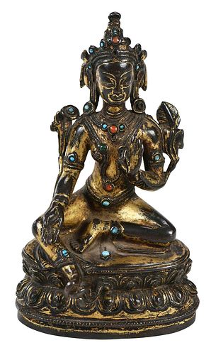 TIBETAN GILT BRONZE TARA FIGUREin a