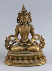 TIBETAN GILT-METAL FIGURE OF A