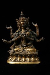 TIBETO-CHINESE GILT BRONZE FIG