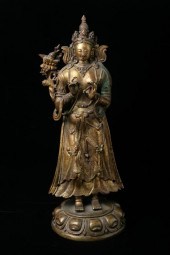 TIBETO-CHINESE GILT BRONZE FIG