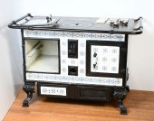 TILED CAST IRON STOVE: Wood/co