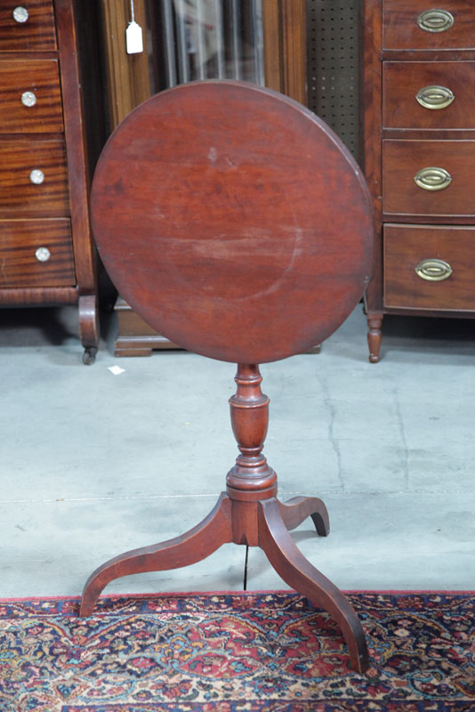 TILT TOP CANDLESTAND. Cherry having