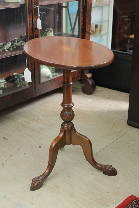 TILT TOP CANDLESTAND. Walnut having