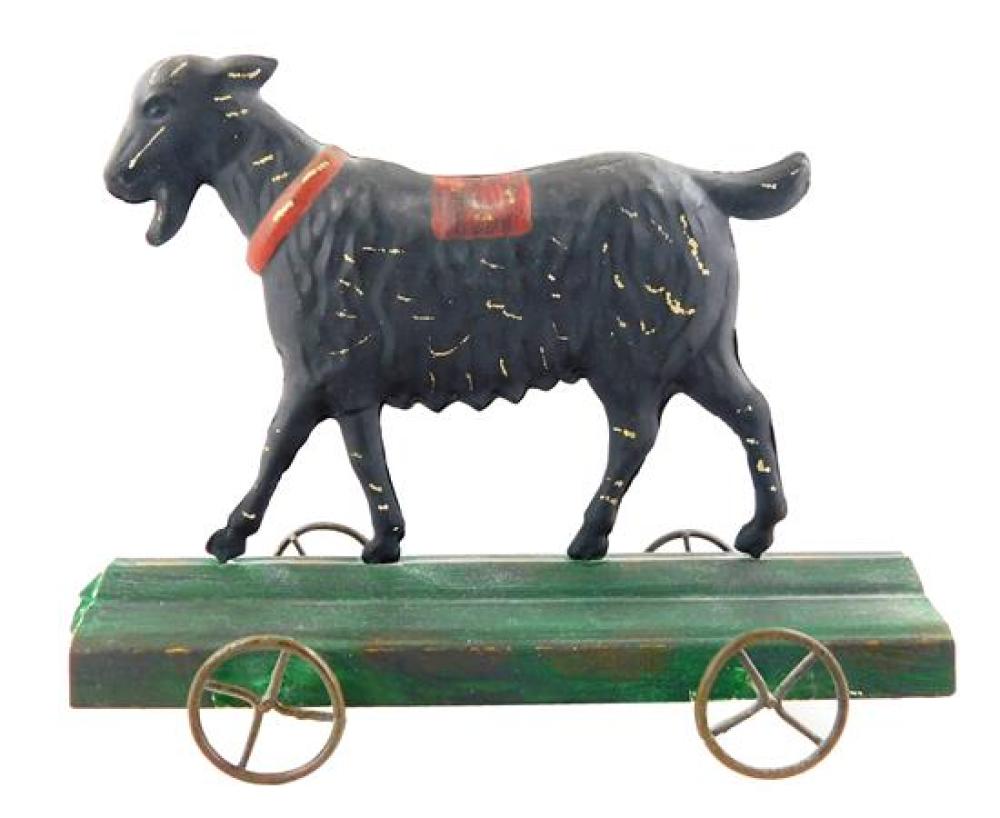 TIN GOAT ON WHEELS TOY, 19TH C.,