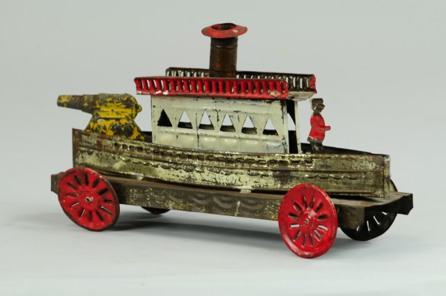 TIN GUN BOAT PULL TOY Stamped tin