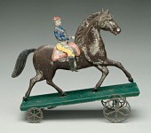 Tin horse and rider pull toy,