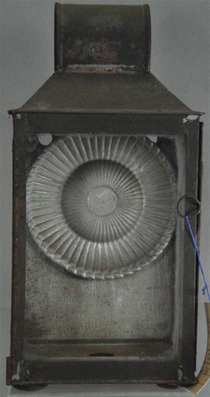Tin lantern with tapered glass