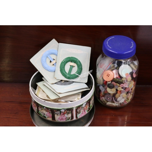 Tin of vintage buttons and buckles
