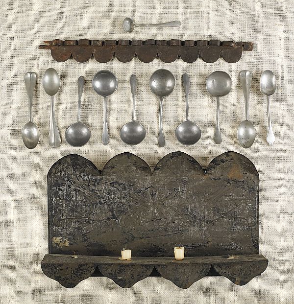 Tin spoon rack together with a wall