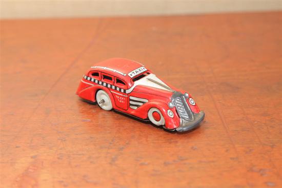 TIN WIND UP TOY. A lithographed