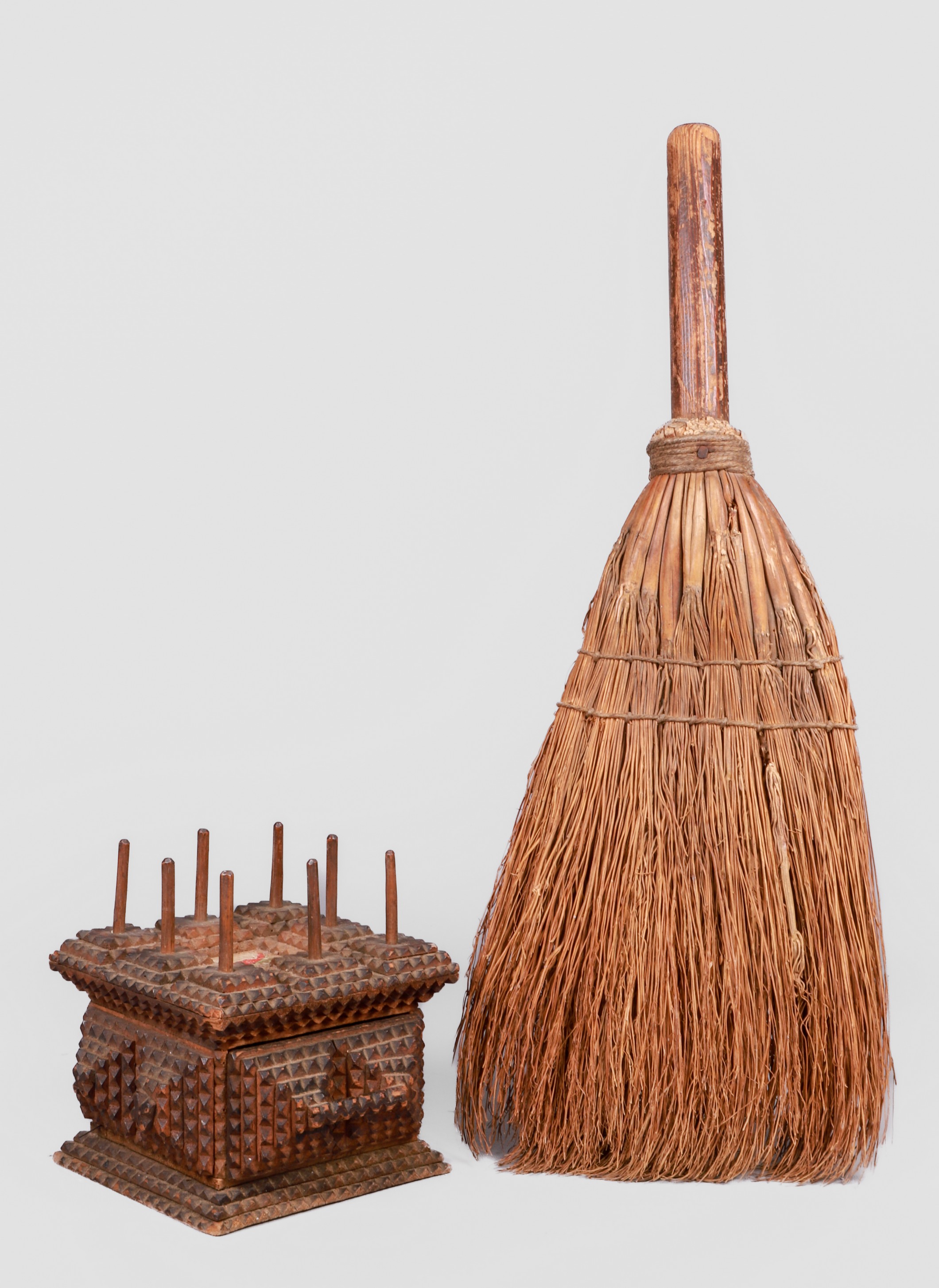 Tramp art spool box and broom to