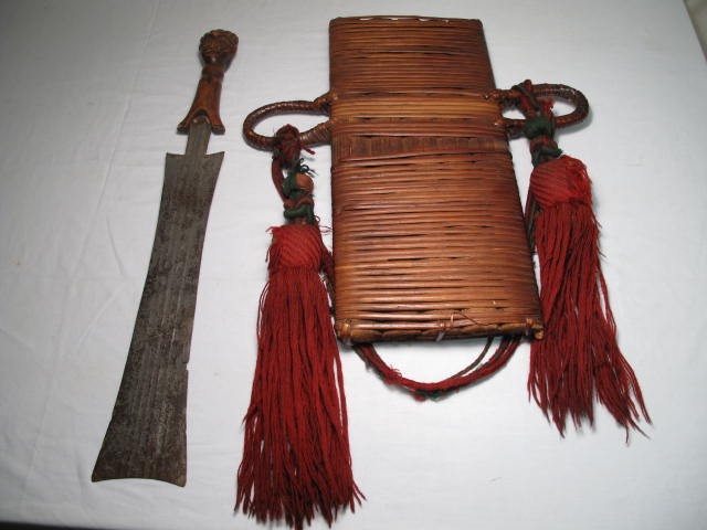 Tribal machete and sheath. Carved