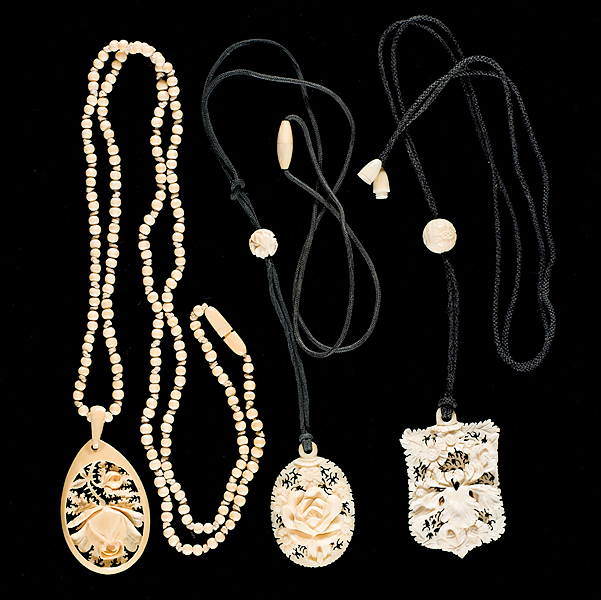 Trio of Carved Ivory Pendants A