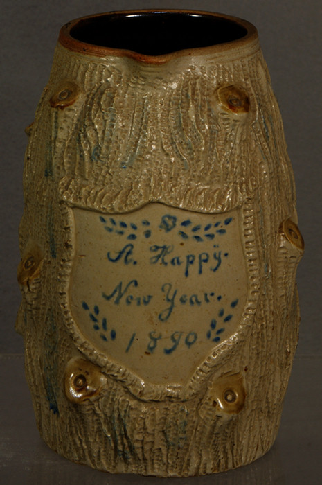 Trre trunk form pottery pitcher