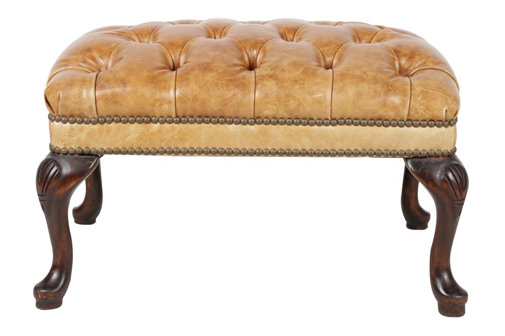 TUFTED LEATHER OTTOMANon carved