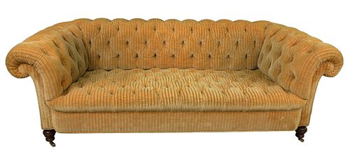 TUFTED UPHOLSTERED SOFA, ON BRASS