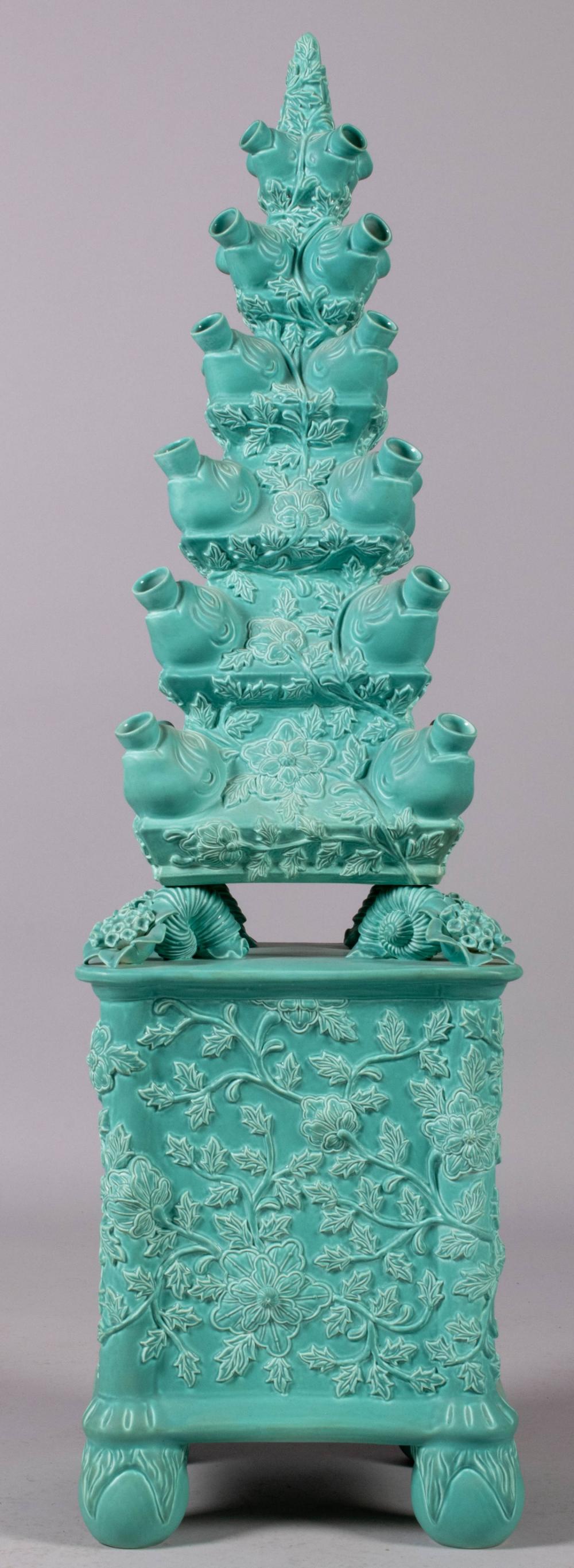 TURQUOISE-GLAZED AND MOLDED