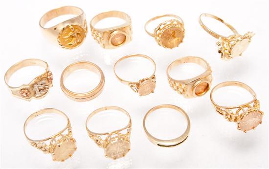 Twelve 14K yellow gold rings 43