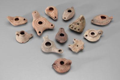 Twelve ancient terracotta lamps: