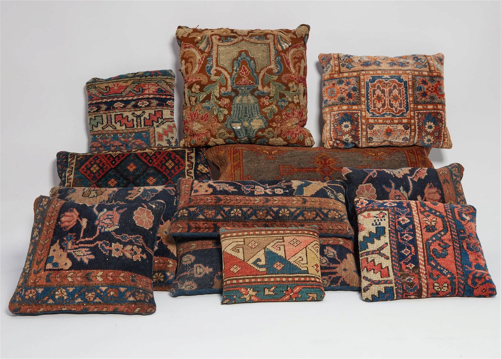 TWELVE CARPET AND TAPESTRY FRAGMENT