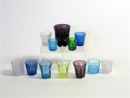 Twelve colored glass items   
