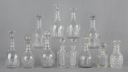 Twelve cut glass decanters