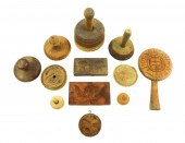 TWELVE EARLY WOODEN BUTTER PRE