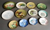 TWELVE ENAMEL DECORATED METAL