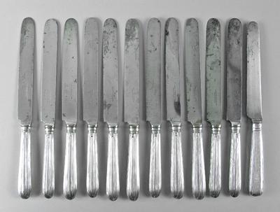Twelve English silver knives: