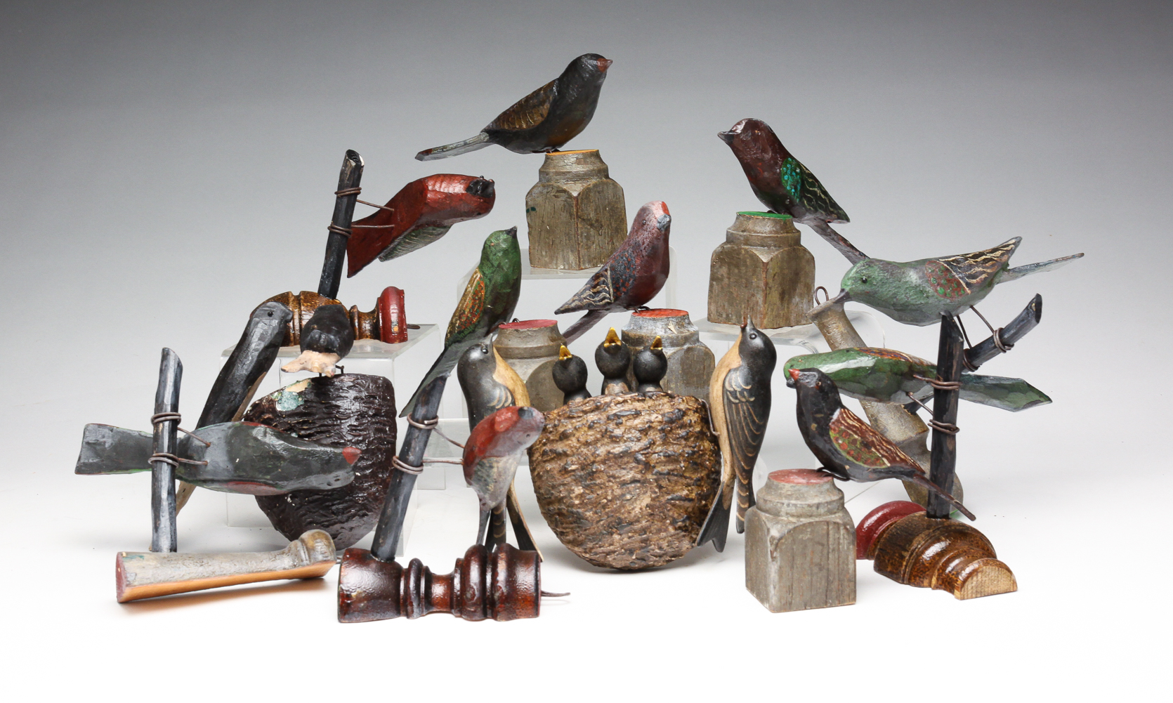 TWELVE FOLKSY AMERICAN CARVED AND