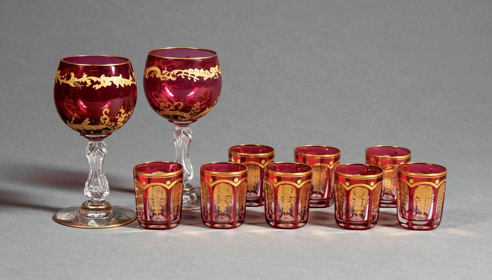 TWELVE GILT DECORATED RUBY CUT TO