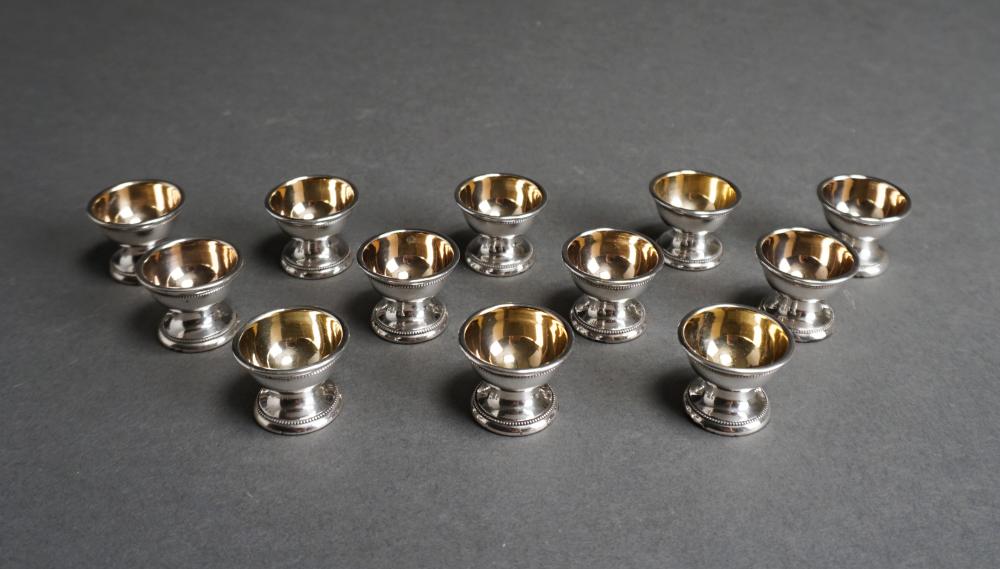 TWELVE GILT WASHED COIN SILVER SALT