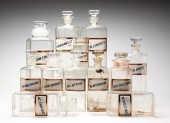 TWELVE GLASS APOTHECARY JARS.