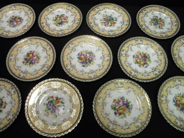 Twelve hand painted plates by