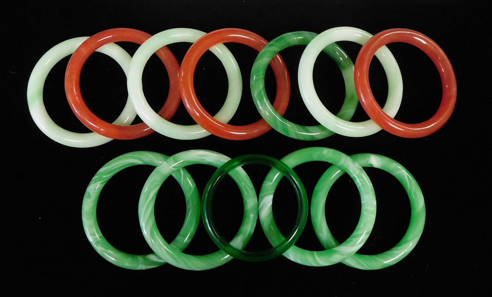 TWELVE HARDSTONE BANGLES, GREEN AND