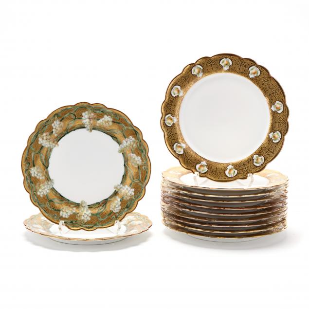 TWELVE LIMOGES GILT RIMMED PLATES